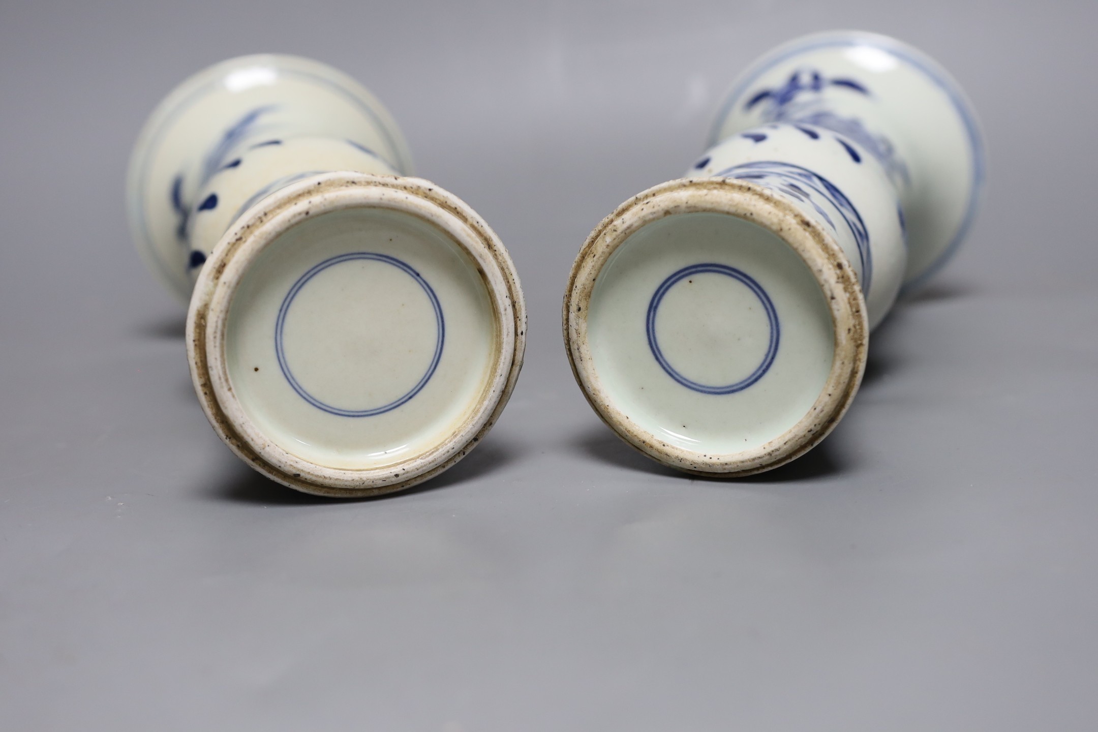 A pair of 19th century Chinese blue and white beaker vases, 23.5cm